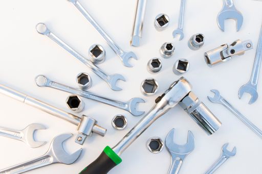 A top view Large group professional kit, different metal wrenches on the white background