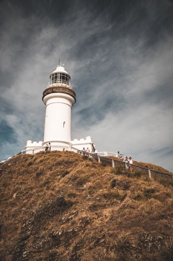 A vertical shot of a lighthouse on cloudy sky background in Australia