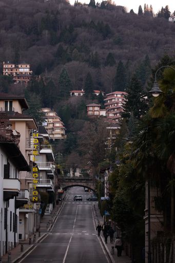 A vertical shot of a street with an array of vacation houses by the lake in Stresa, Italy