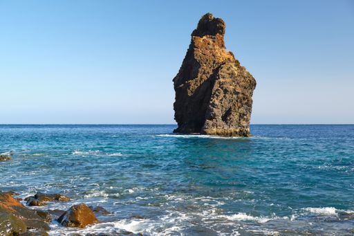 Roque de la Bonanza natural monument with blue sea at Las Playas beach on El Hierro. Vacation and traveling on the Canary Islands.
