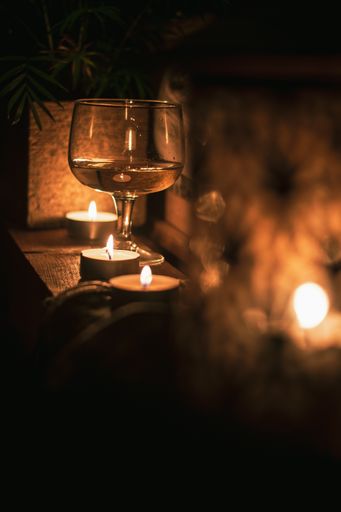 The selective focus shot of white wine cups in romantic atmosphere.