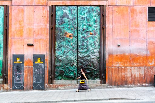 Big bronze doors with sculptured relief. Old Stockholm power plant.