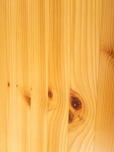 A closeup shot of a pine wood plank surface texture as background