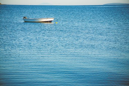 A small fishing boat moored on a sea near Vir, Croatia