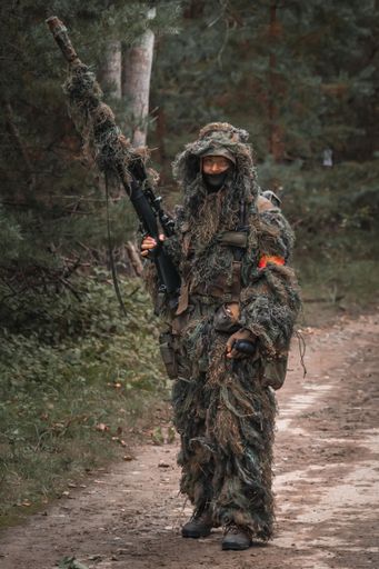 A real soldier in the forest with a special uniform