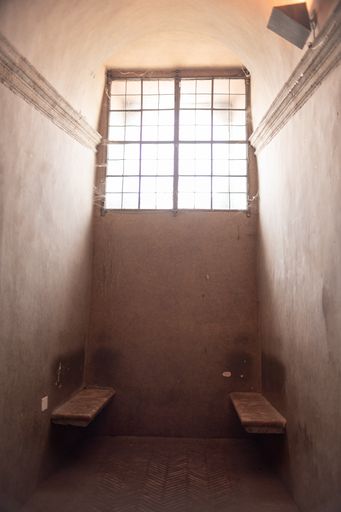 A vertical shot of a prison ward under the sunlight