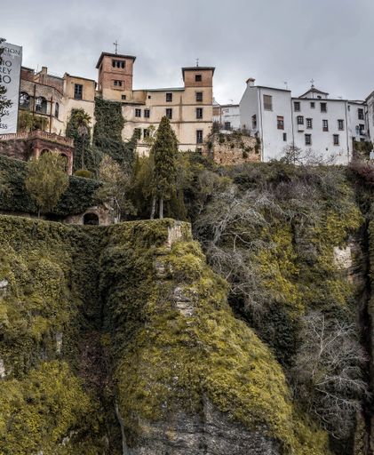 A vertical low angle shot of incredible Jardines De Cuenca Ronda  inSpain