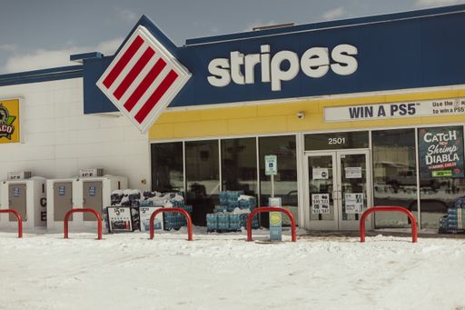A view of a snowed gas station convenience store