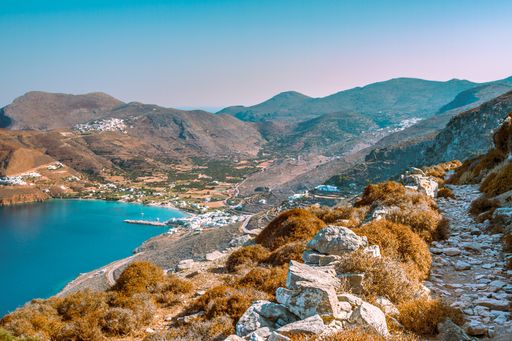 A hiking trail viewed from the highlands to Aegiali bay on the Greek island of Amorgos