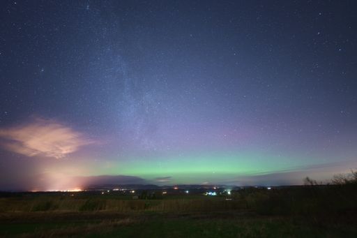 Green and purple colour bands - the aurora borealis and Milky Way across Strathearn