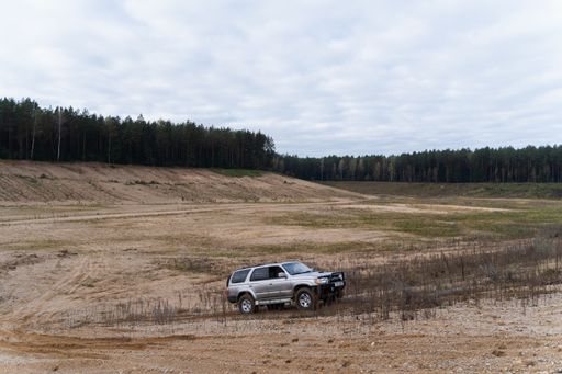 A view of a Toyota 4Runner riding against a sandy forest in a canyon