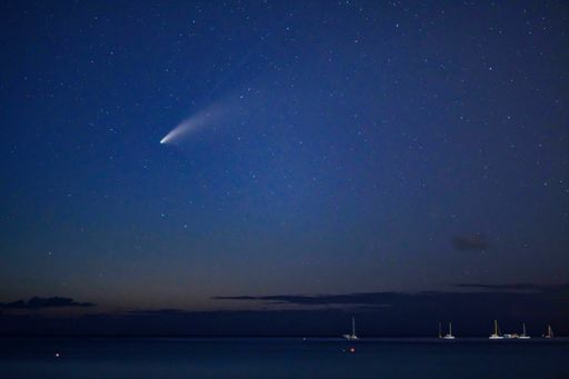 A picturesque view of the coast and starry night