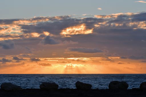 An amazing view of the dramatic sky on the beach at sunset