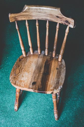 A high angle shot of an old wooden chair