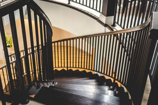 A high angle shot of a wooden stairway