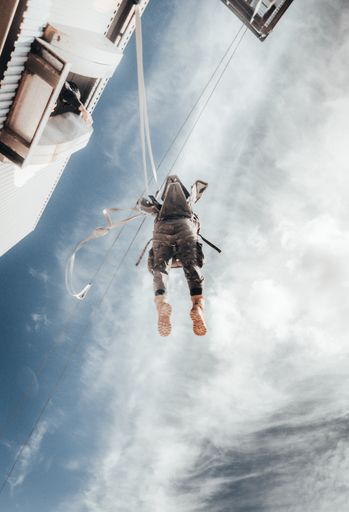 An amazing shot of an airborne forces soldier landing in a mission zone