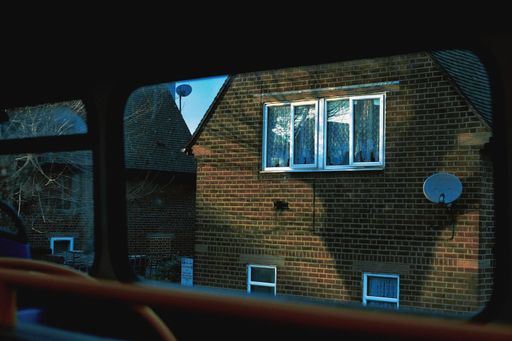 A view from a bus to a building