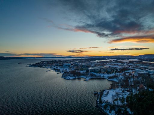 A beautiful shot of a seascape under the cloudy skies in Fornebu, Norway