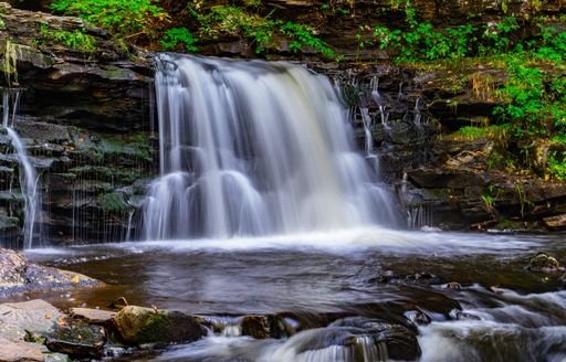 A beautiful view of a waterfall in Ricketts Glen State Park, PA