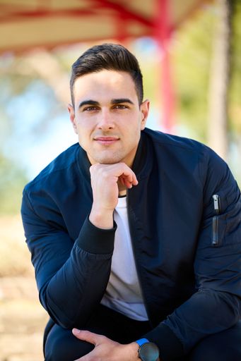 A closeup shot of Caucasian model man posing in front of the camera