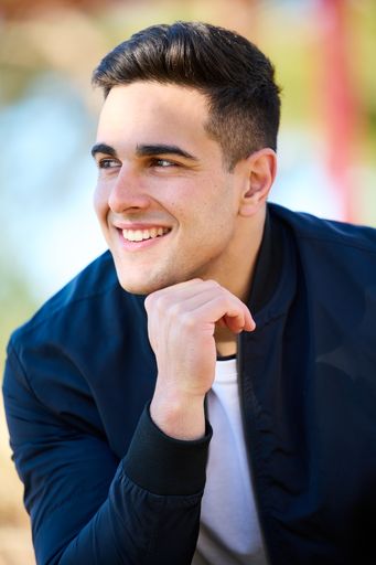 A closeup shot of Caucasian model man posing in front of the camera