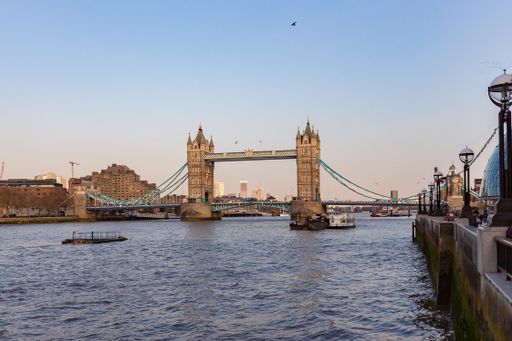 A beautiful shot of tower bridge at dusk as seen from St. Katharine Docks in London