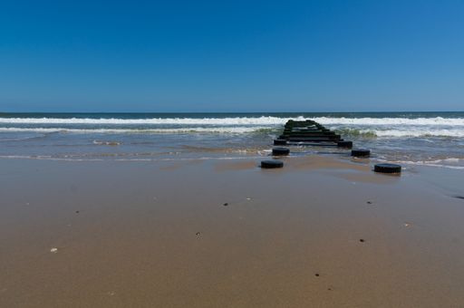A beautiful shot of walking equipment placed on a beach.