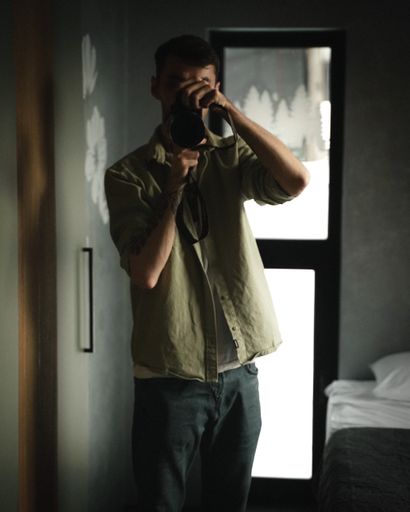 A beautiful shot of a man taking a photo with a camera