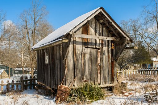 A small wooden house during winter