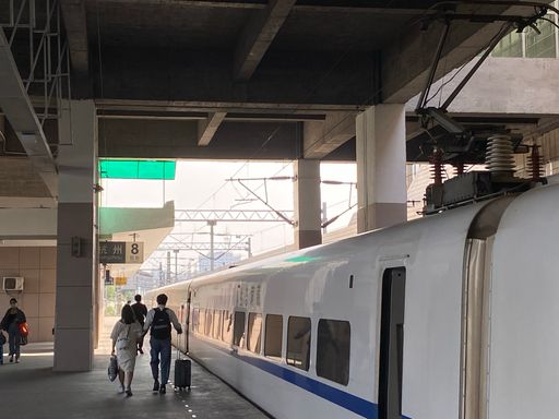 An ancient railway station and a highspeed train in China
