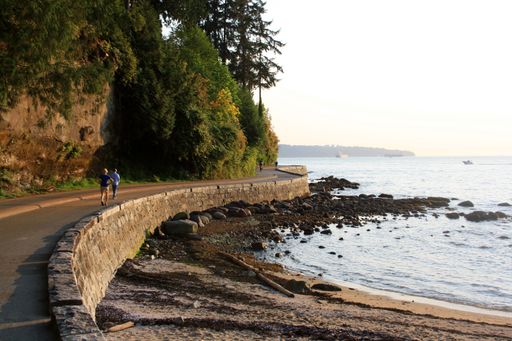 A beautiful view of a sidewalk at the beach at Vancouver Stanley Park in Canada