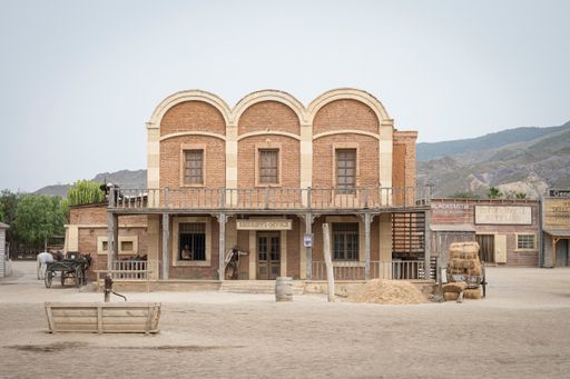 A Wild west movie set with some men fighting in a gunfight