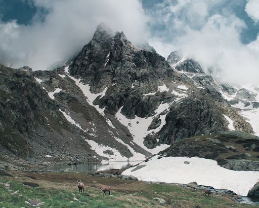 A beautiful shot snowy mountains under the cloudy skies