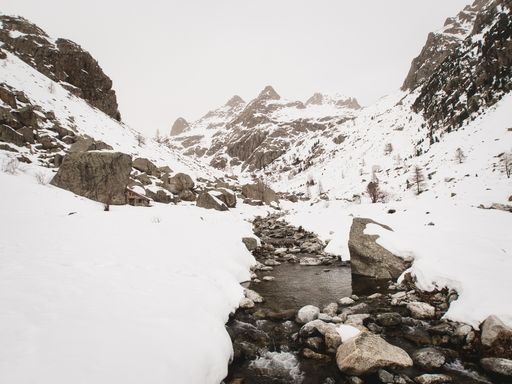 A beautiful shot snowy mountains under the cloudy skies