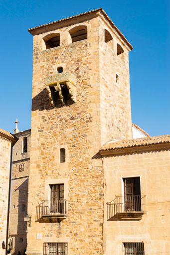 A vertical shot of a medieval tower of the Palace of the Golfines de Abajo in Caceres, Estremadura, Spain