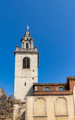 A vertical shot of St Magnus The Martyr in London, UK with a clear blue sky background
