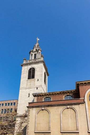 A vertical shot of St Magnus The Martyr in London, the UK with a clear blue sky background