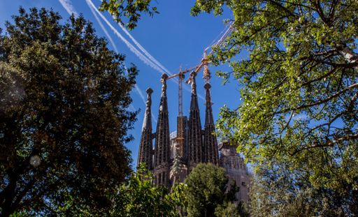 The Sagrada Familia basilica viewed from the Plaza de Gaudi in Barcelona, Catalonia, Spain