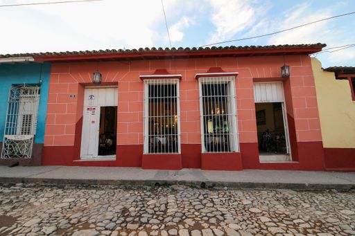 A beautiful view of a colored building in Trinidad under the blue sky