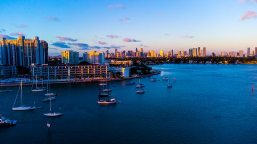 A scenic view over Miami skyline and waterway at golden hour in United States of America