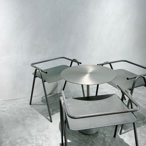 A beautiful shot of modern chairs and table - in grayscale