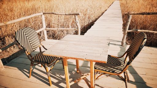 A beautiful shot of modern chairs and table in terrace