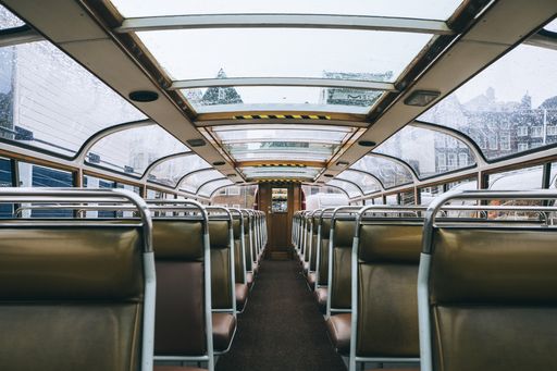 An inside shot of a bus with leather seats