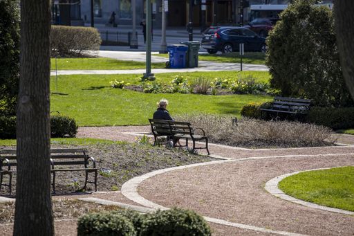 People are enjoying walks in the parks of downtown Chicago wearing masks and gloves despite the fears of Covid-19 corona virus. the city is shutdown