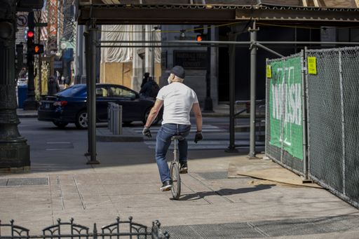 biking in the empty streets in the downtown Chicago area during the Covid-19 virus pandemic. the city is closed due to quarantine and business closed