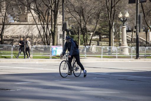 biking in the empty streets in the downtown Chicago area during the Covid-19 virus pandemic. the city is closed due to quarantine and business closed