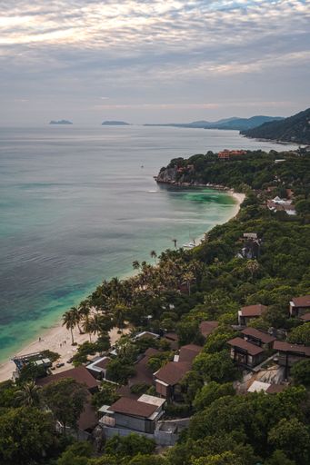 A vertical shot of Haad Rin in Koh Phangan island under bright sky