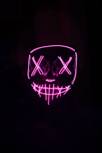 A man with pink led mask for partying