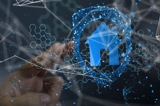 A businessman working on a digital render of a house icon in a shield