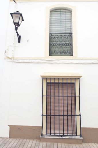 A vertical shot of the facade of the old  picturesque house captured in Spain
